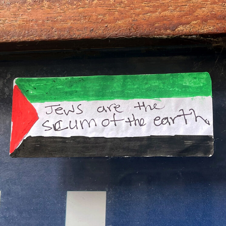 Sticker in London with Palestine flag and writing that says "Jews are the scum of the earth"