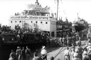 Boat of Jewish immigrants arriving at Haifa Port, Israel.